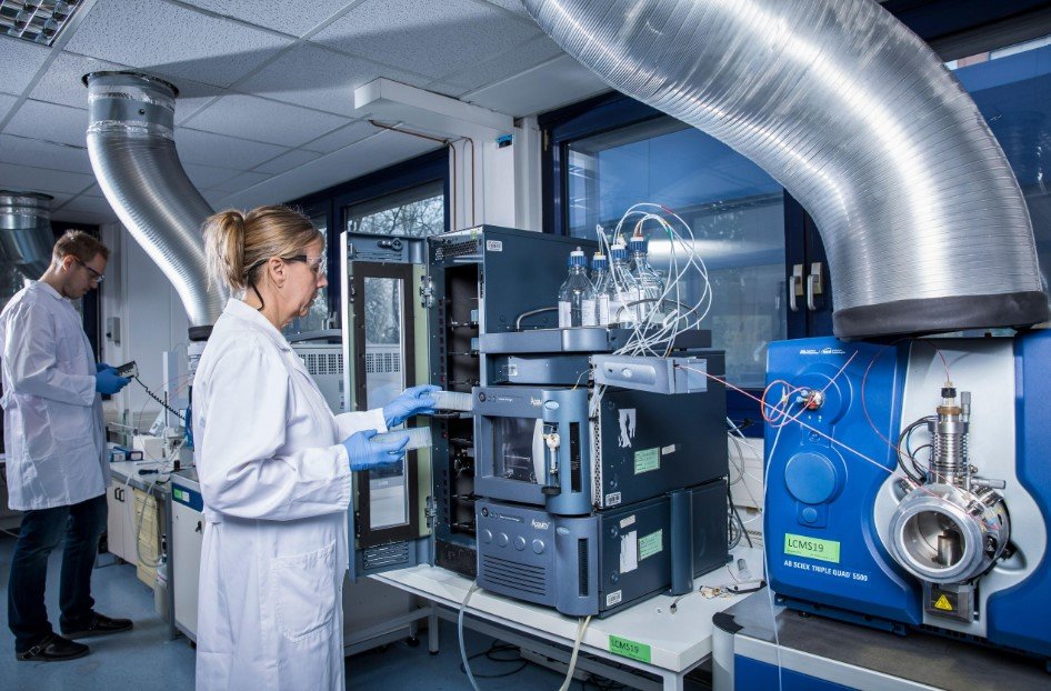 Research scientists working with peptide laboratory equipment